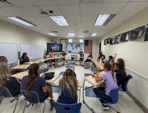  The team gathers in a circle as Khara Vessel leads an emotional moment of reflection. After Kahara had the players close their eyes, she asked the players, “Who believes this team has what it takes to win States?” Then asked the team to raise their hands if they believe they will.